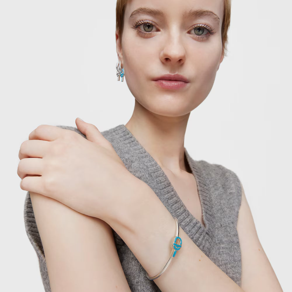 TOUS. Pulsera esclava de plata y motivo en color azul MANIFESTO